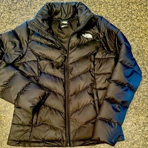 Women’s black north face winter coat.